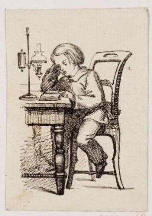 Lesender Junge am Tisch