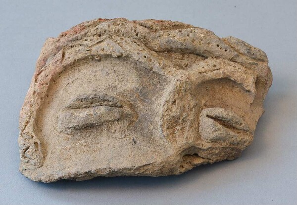 Clay mask (fragment)