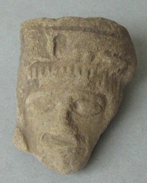 Clay head (fragment)