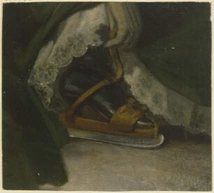Fuß einer Dame mit Schlittschuh