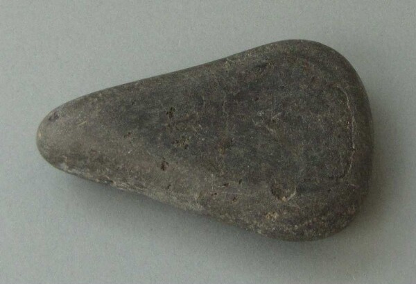 Stone axe blade (?)