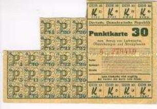 Fragment einer Bezugskarte der DDR für Textilien mit Propaganda für den Fünfjahrplan auf der Rückseite (blanko)