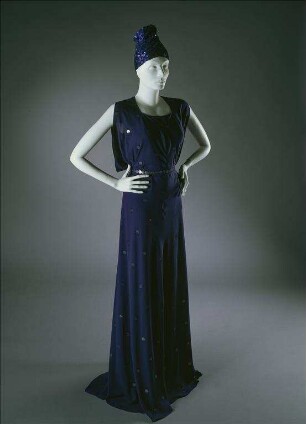 Blaues Abendkleid aus Doppelgewebe mit eingewebten Pailletten und blauer, turbanähnlicher Paillettenkappe (Archivtitel)