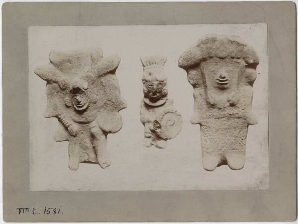 Three clay figures.