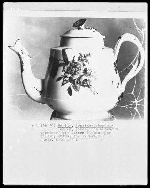 Teekanne mit bunten Blumen