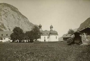 Schönau am Königssee. Sankt Bartholomäus (um 1698/1700, 1868 Weihe nach Erneuerung, 1902/1904 Renovierung) auf der Halbinsel Hirschau am Königssee. Ansicht der Inselseite