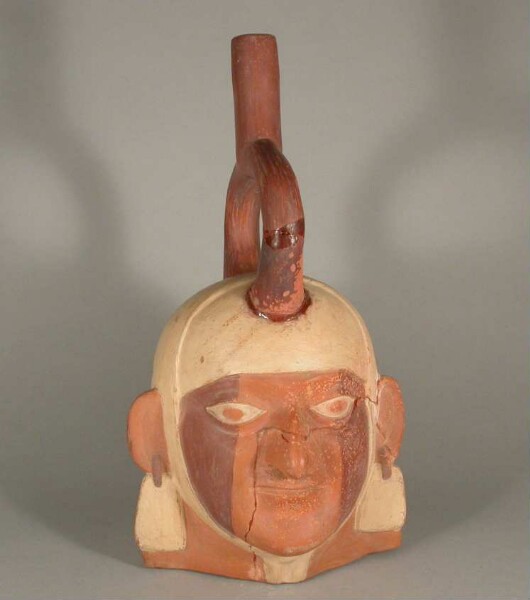 Figure vessel with stirrup spout