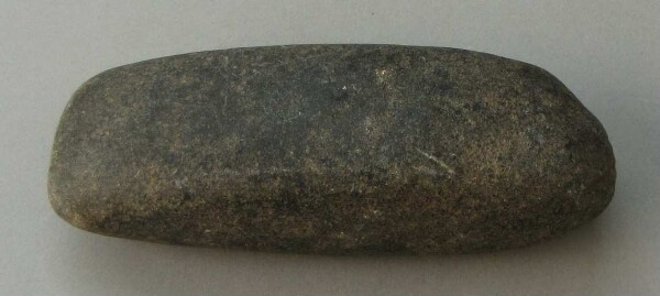 Stone axe blade (?)