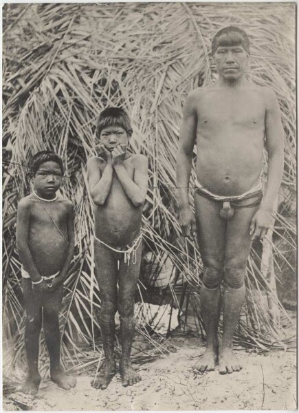 Paressi-Kabeshi man with his two sons on the Rio Guapore