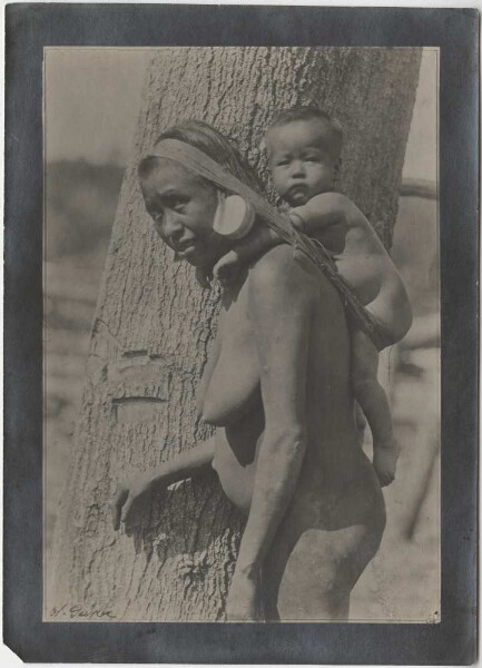 "Botokuden" woman with child in carrier basket