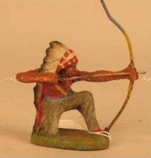 Indianer, knieend schießend mit Pfeil und Bogen