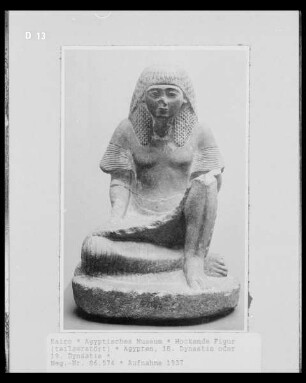 Hockende Figur