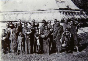 Hpoongyies (Buddist priests) with Their begging bowls ready to go out begging