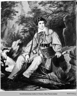 Sitzender junger Mann in Tracht in Landschaft