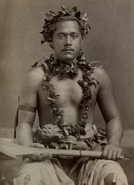 "Man with head and arm jewellery, tools in hand, Samoa-Ins."