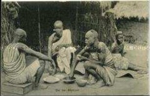 Afrikaner in Togo beim Essen