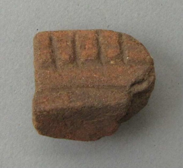 Rim sherd of a clay vessel