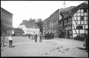 Köslin. Straße mit Pferdefuhrwerken