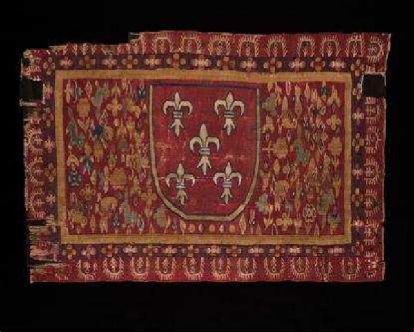 Fabric fragment with heraldic lily and bird motif