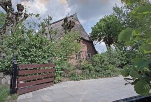 Poststraße 14: Fachwerkhaus mit Reetdach: Giebelseite Wohntrakt