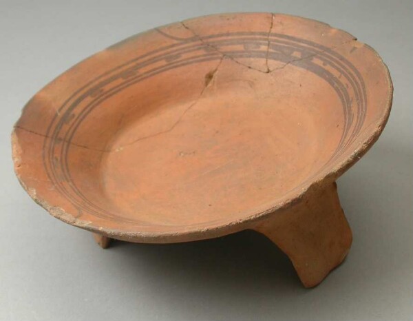 Three-footed clay bowl