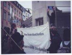 Straßenumbenennung - Attac-Aktionstag gegen Steueroasen in Luxemburg