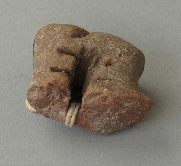 Fragment of a clay vessel decoration