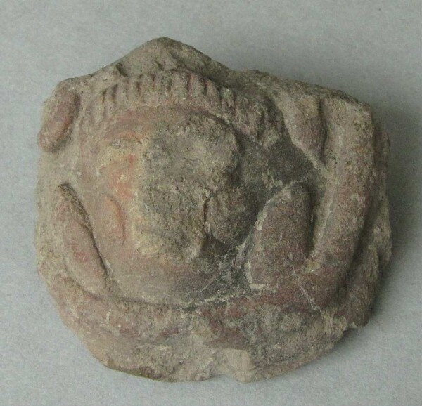 Clay head (fragment)