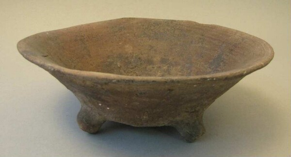 Three-footed clay bowl