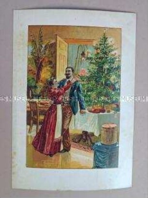 Paar unter dem Weihnachtsbaum