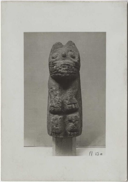 Stone figure of a squatting jaguar made of limestone. Height 40 cm. Front view.