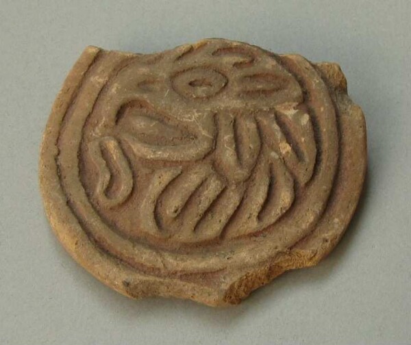 Handle of a clay vessel (fragment)