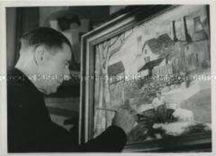 Der Maler Rudolf Ausleger arbeitet an einem Gemälde