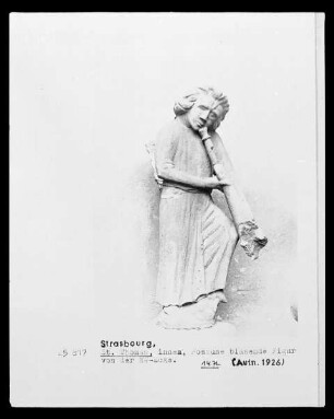 Posaune blasende Figur