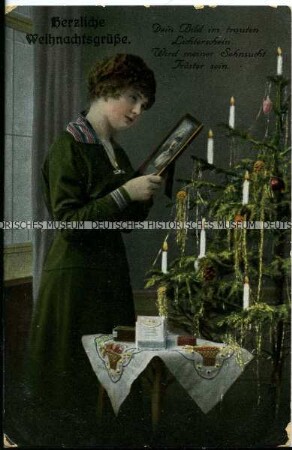 Weihnachtspostkarte, Frau mit Soldatenbild, mit Vers