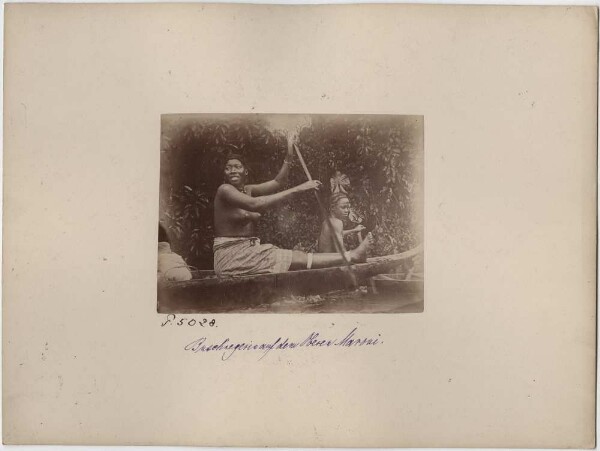 Woman rowing on the Upper Maroni