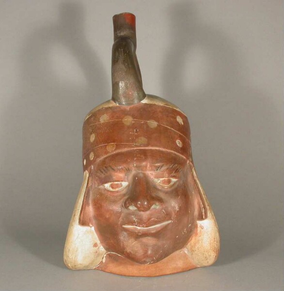 Figure vessel with stirrup spout