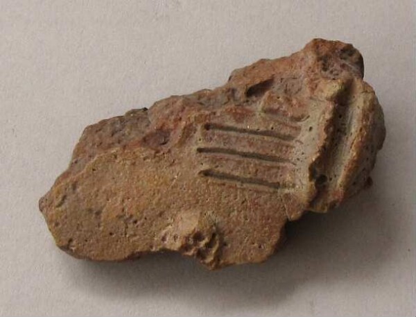 Fragment of a clay vessel