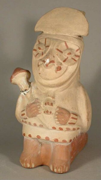 Standing anthropo-zoomorphic figure (bird/owl) with club