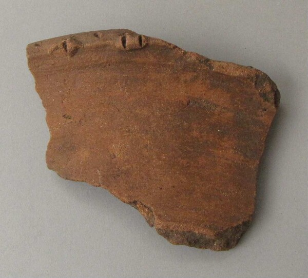 Rim sherd of a clay vessel