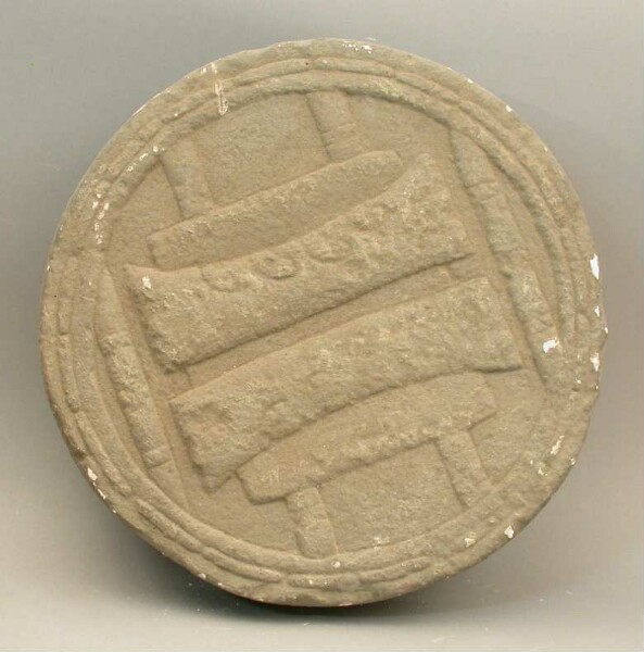 Plaster cast of a round shield stone replica