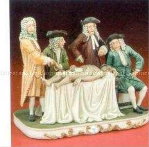 Figurengruppe: vier Ärzte mit einem Patienten