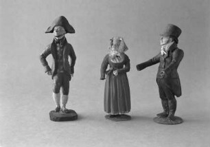 Drei Figuren in bürgerlicher Tracht