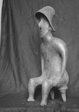 Figur eines Sitzenden