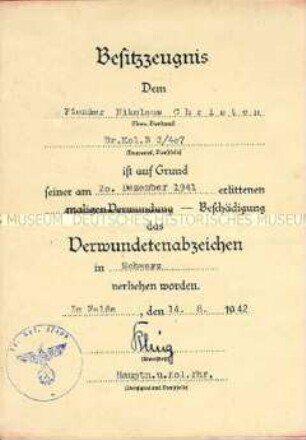 Urkunde zum Verwundetenabzeichen in Schwarz von Nikolaus Christen
