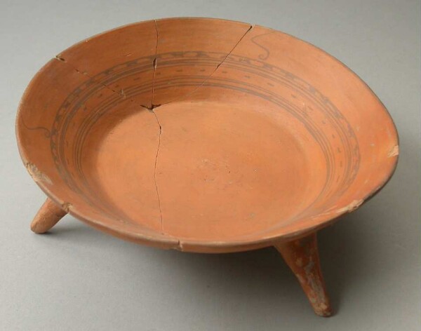 Three-footed clay bowl