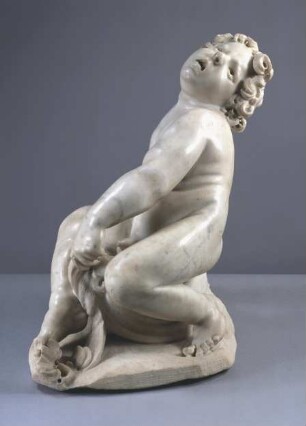 Putto auf einem Delphin