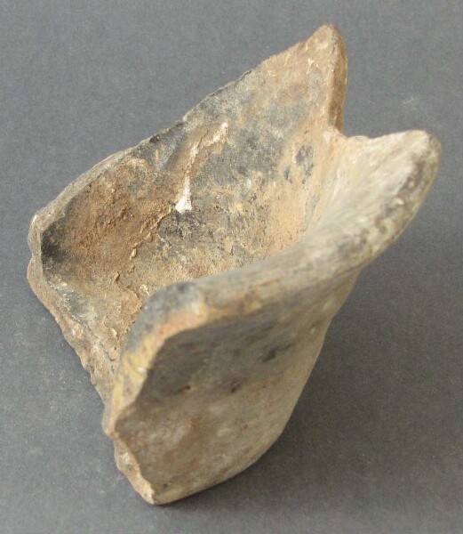 Fragment of a clay vessel