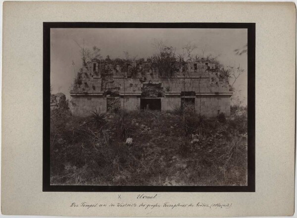 "The temple on the west side of the burial complex. Its eastern façade. (With two members of the expedition)"