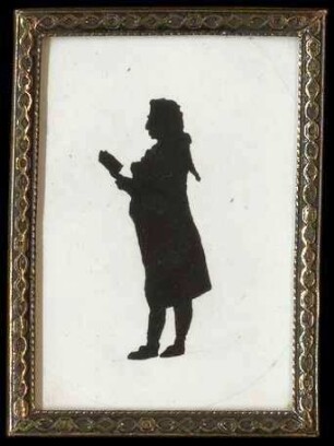 Silhouette einer nicht identifizierten, lesenden Person (Mann, 18. Jh.), 7,5 cm hoch und 5,3 cm breit, in Glasrahmen
